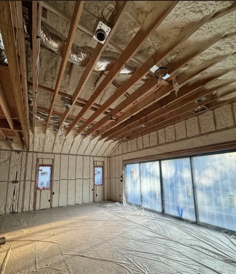 Interior walls and ceiling insulated with spray foam during new construction in Matthews
